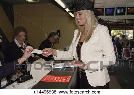 Stock Photo - Placing a bet. Fotosearch