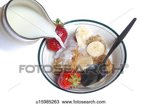 Pouring milk on breakfast cereal View Large Photo Image Stock Image - Pouring milk on breakfast cereal. Fotosearch