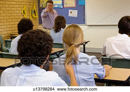 Pulling a girls hair in class View Large Photo Image Picture - Pulling a girls hair in class. Fotosearch