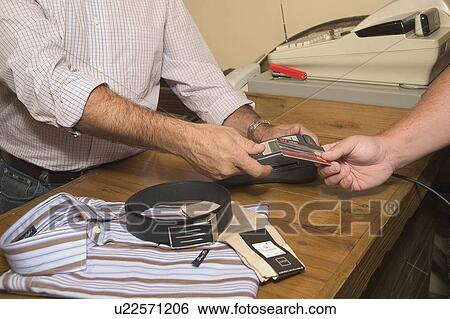 Stock Photograph - Purchase on credit card. Fotosearch