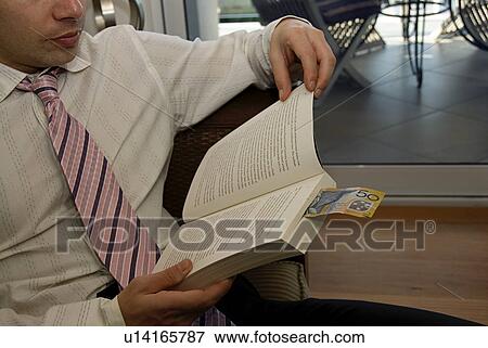 Stock Photo - Reading a book. Fotosearch