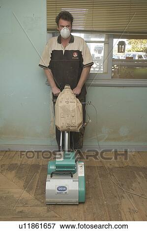 Stock Photo - Refinishing a wood floor. Fotosearch
