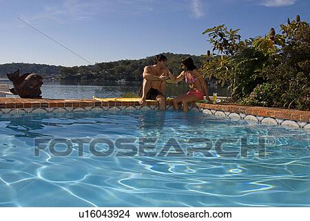 Picture - Relaxing by the pool. Fotosearch