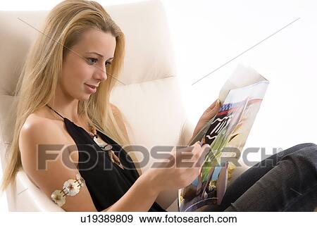 Stock Photo - Relaxing with a magazine. Fotosearch