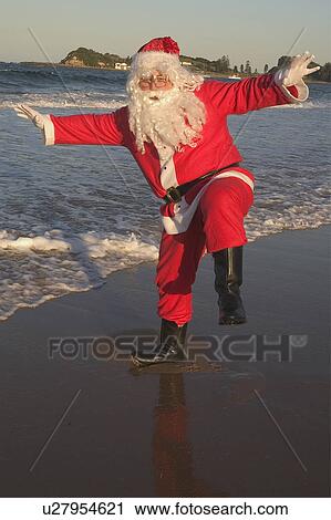 Stock Image - Santa at beach. Fotosearch