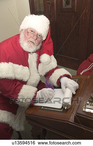 Stock Photograph - Santa at his writing desk. Fotosearch