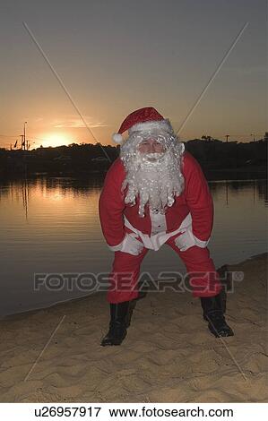 Stock Photo - Santa at sunset. Fotosearch