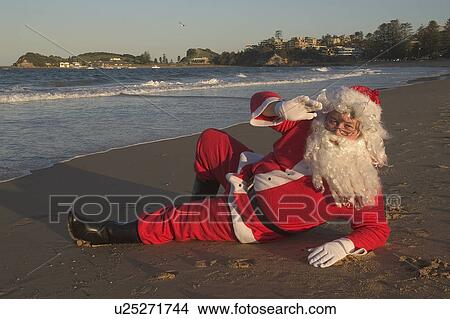 Santa on holiday View Large Photo Image Picture - Santa on holiday. Fotosearch