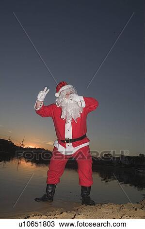 Stock Image - Santa pretending to drown. Fotosearch