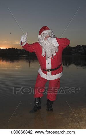 Stock Image - Santa swimming. Fotosearch