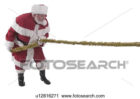 Stock Image - Santa Tug-o-war. Fotosearch