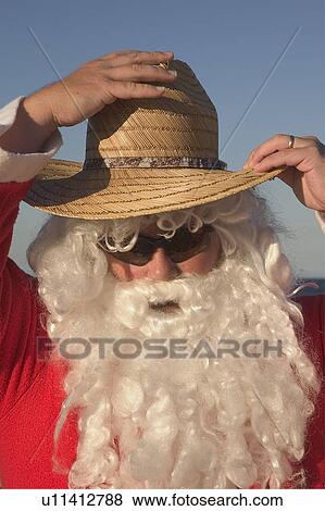 Santa with beach hat View Large Photo Image Stock Photo - Santa with beach hat. Fotosearch