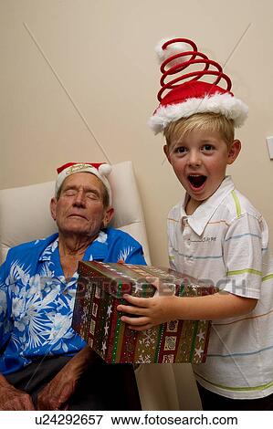 Stock Photo - Sleeping Grandpa on Christmas. Fotosearch