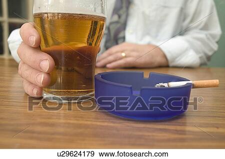 Stock Photo - Smoking in a bar. Fotosearch