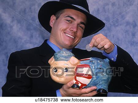 Stockbroker with a piggy bank View Large Photo Image Stock Photo - Stockbroker with a piggy bank. Fotosearch