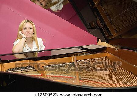 Student at the piano View Large Photo Image Stock Image - Student at the piano. Fotosearch