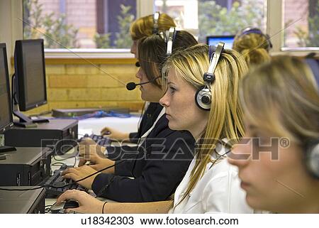 Stock Image - Students at computer desks. Fotosearch