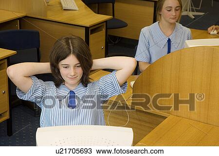 Stock Image - Students at computer desks. Fotosearch