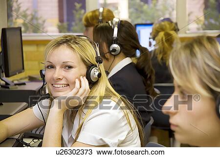 Stock Image - Students at computer desks. Fotosearch