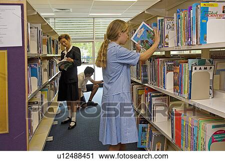 Stock Image - Students in the library. Fotosearch