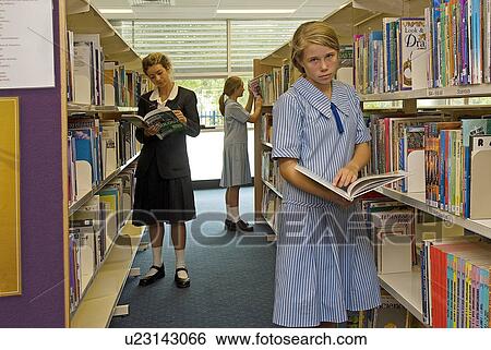 Stock Photograph - Students in the school library. Fotosearch