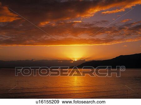 Stock Photo - Sunset over Cairns Harbour. Fotosearch