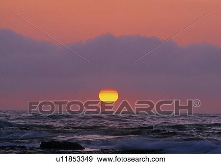 Stock Photo - Sunset over water. Fotosearch