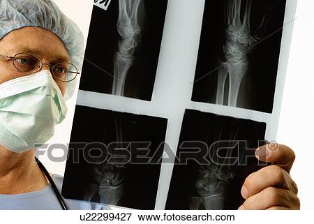 Stock Photo - Surgeon with Xrays. Fotosearch