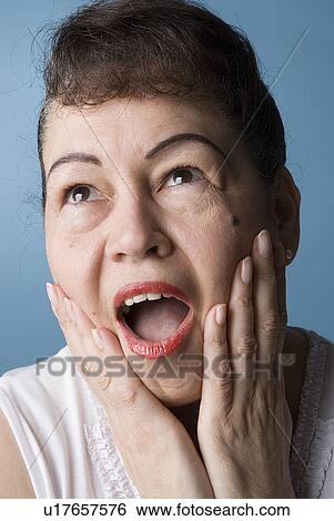 Surprised and happy woman View Large Photo Image Stock Photograph - Surprised and happy woman. Fotosearch