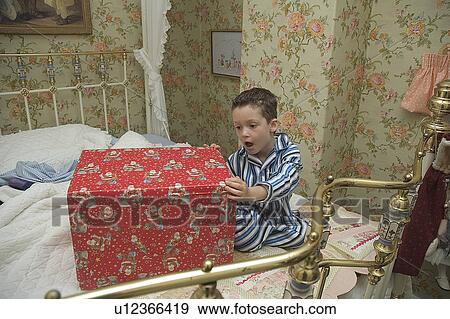 Stock Photo - Surprised child at Christmas. Fotosearch