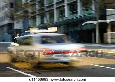 Stock Image - Taxi in the city. Fotosearch