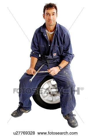 Tire mechanic View Large Photo Image Stock Photo - Tire mechanic. Fotosearch