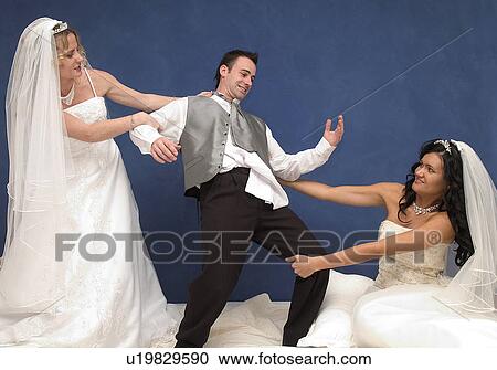 Two brides on man View Large Photo Image Stock Image - Two brides on man. Fotosearch