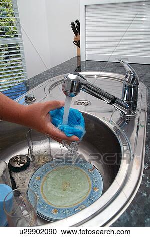 Washing dishes View Large Photo Image Stock Image - Washing dishes. Fotosearch