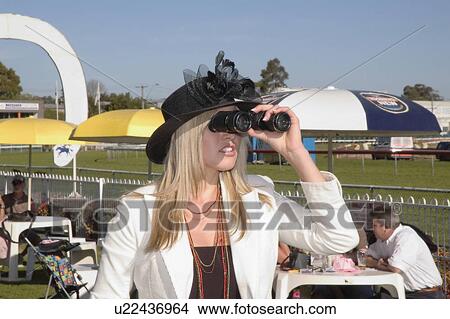 Picture - Watching through the binoculars. Fotosearch