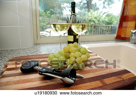 Wine and grapes in the kitchen View Large Photo Image Stock Image - Wine and grapes in the kitchen. Fotosearch