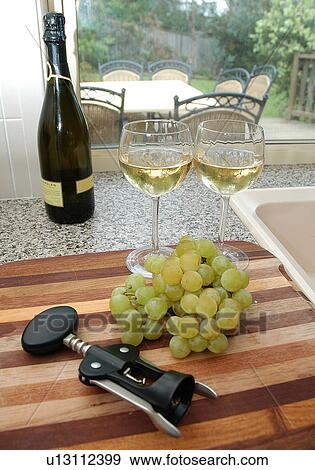 Wine and grapes in the kitchen View Large Photo Image Stock Photo - Wine and grapes in the kitchen. Fotosearch