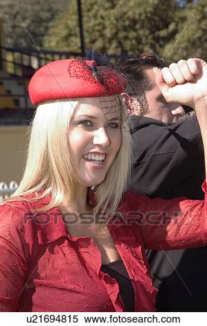 Stock Photography - Woman cheering at the races. Fotosearch