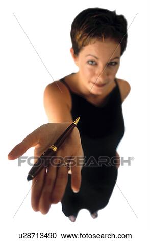 Woman holding a pen View Large Photo Image Stock Image - Woman holding a pen. Fotosearch