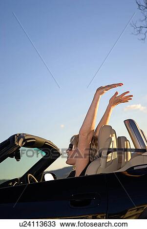 Woman in a convertible View Large Photo Image Stock Image - Woman in a convertible. Fotosearch