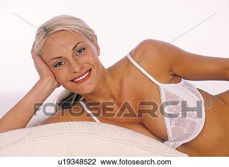 Stock Image - Woman in a white bra. Fotosearch