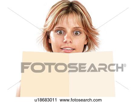 Woman looking at a piece paper View Large Photo Image Stock Image - Woman looking at a piece paper. Fotosearch