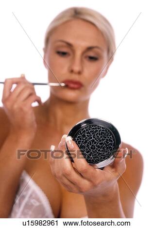 Woman putting on lip liner View Large Photo Image Stock Image - Woman putting on lip liner. Fotosearch