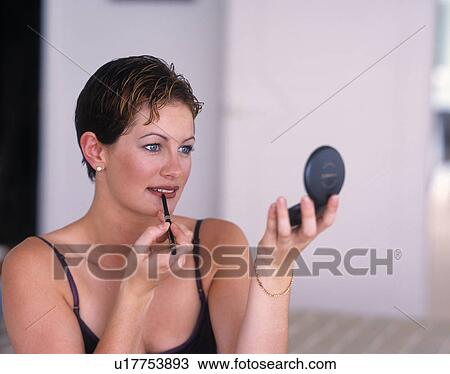 Woman putting on lip liner View Large Photo Image Stock Image - Woman putting on lip liner. Fotosearch
