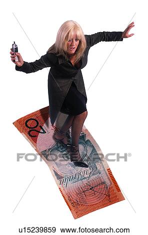 Stock Photo - Woman surfing on a dollar. Fotosearch