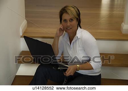 Woman with laptop View Large Photo Image Stock Image - Woman with laptop. Fotosearch