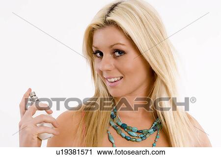 Stock Image - Woman with perfume. Fotosearch