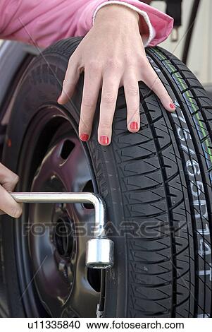 Stock Image - Woman with spare tire. Fotosearch