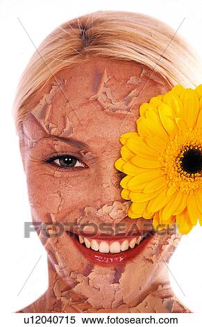 Stock Photography - Woman's face peeling with a flower eye. Fotosearch