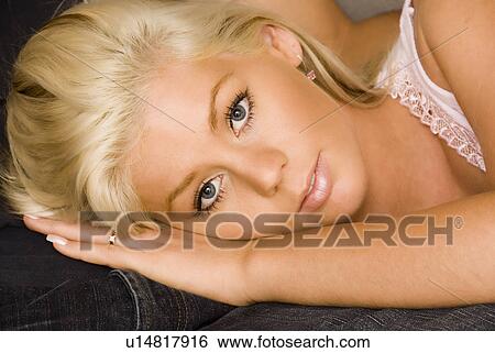 Stock Photograph - Woman's head on lap. Fotosearch
